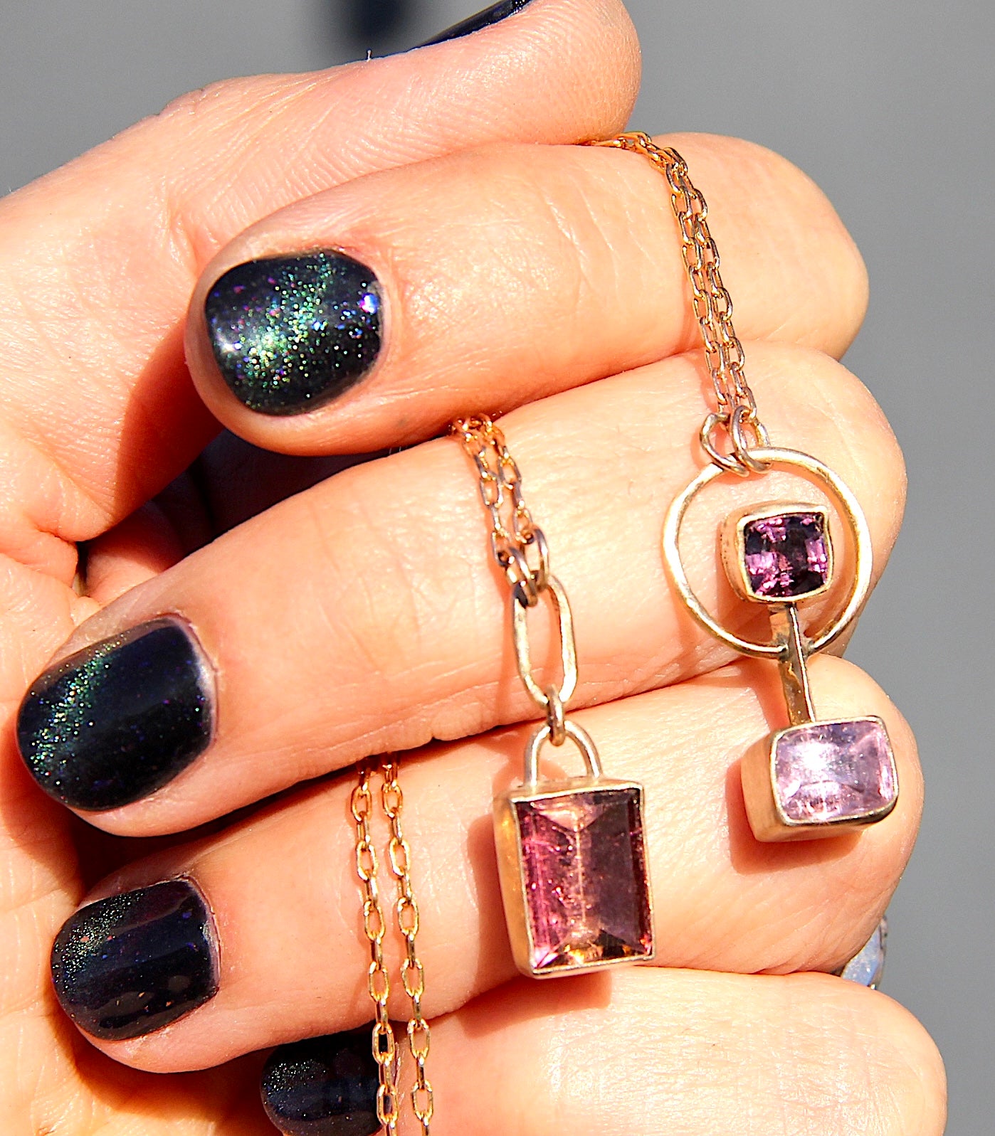 Barbell style necklace with a burgundy spinel and pink tourmaline