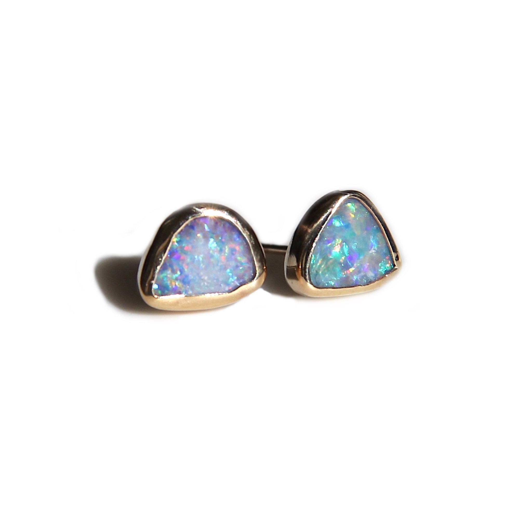 Asymmetrical opal studs in gold