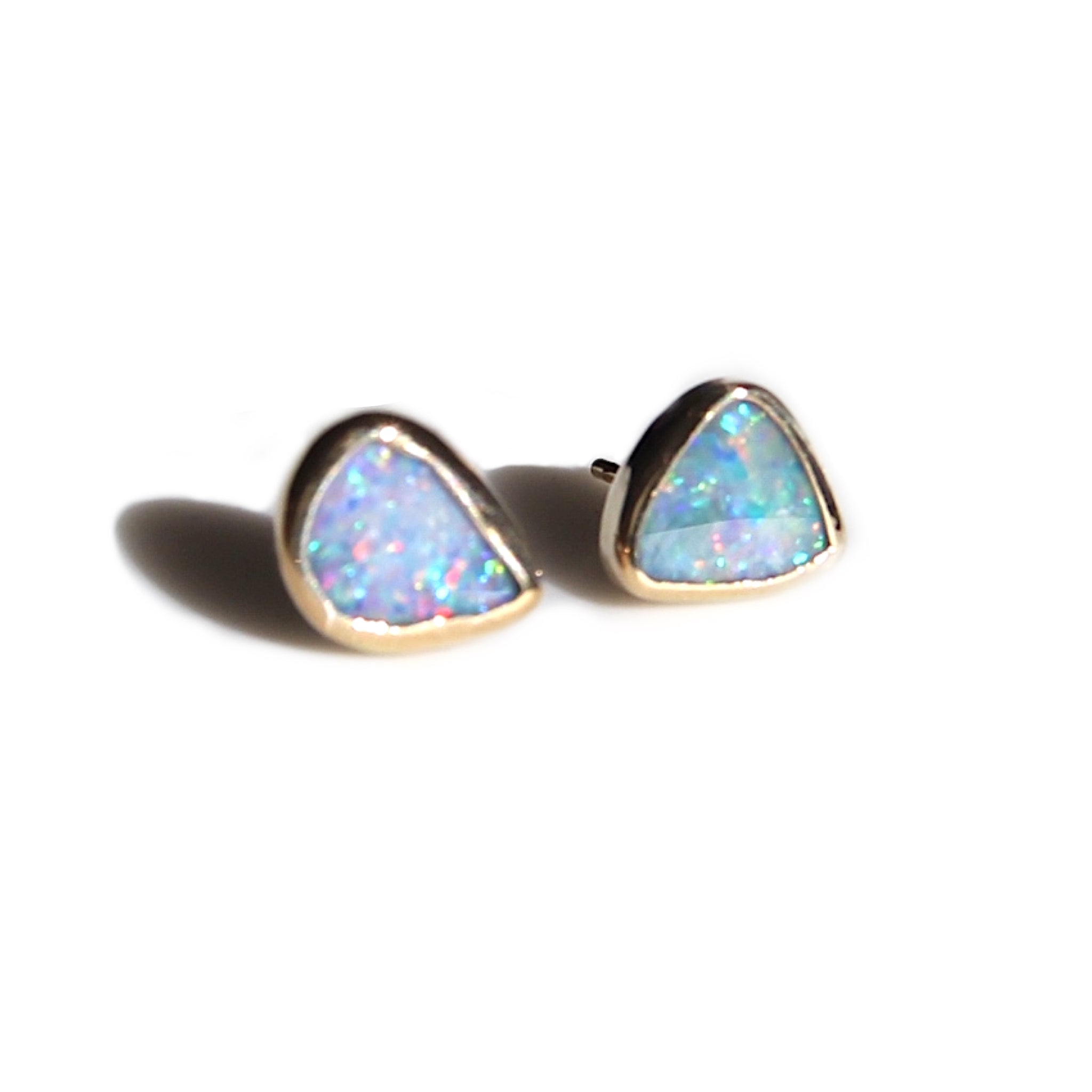 Asymmetrical opal studs in gold